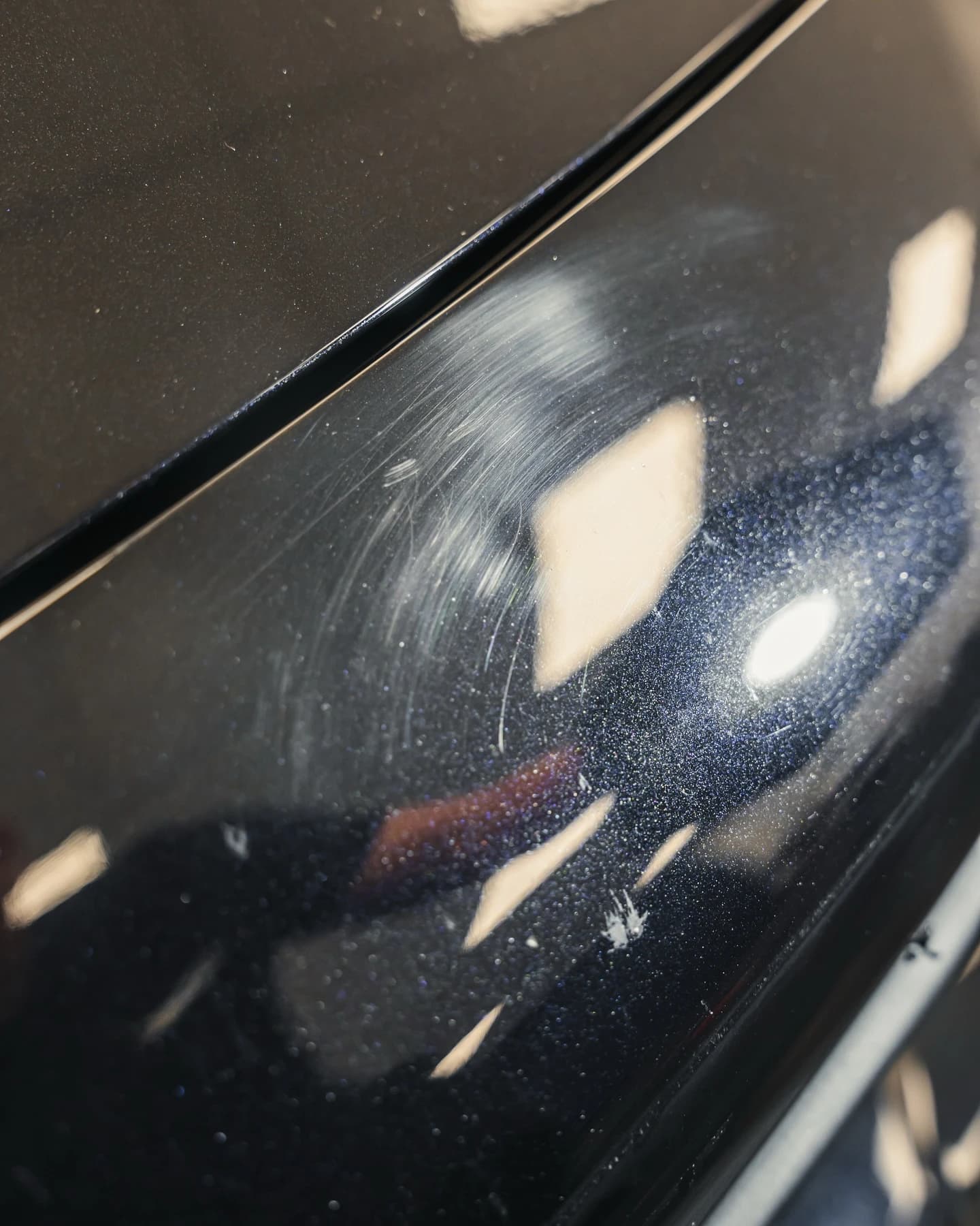 Paintwork with swirl marks before machine polishing