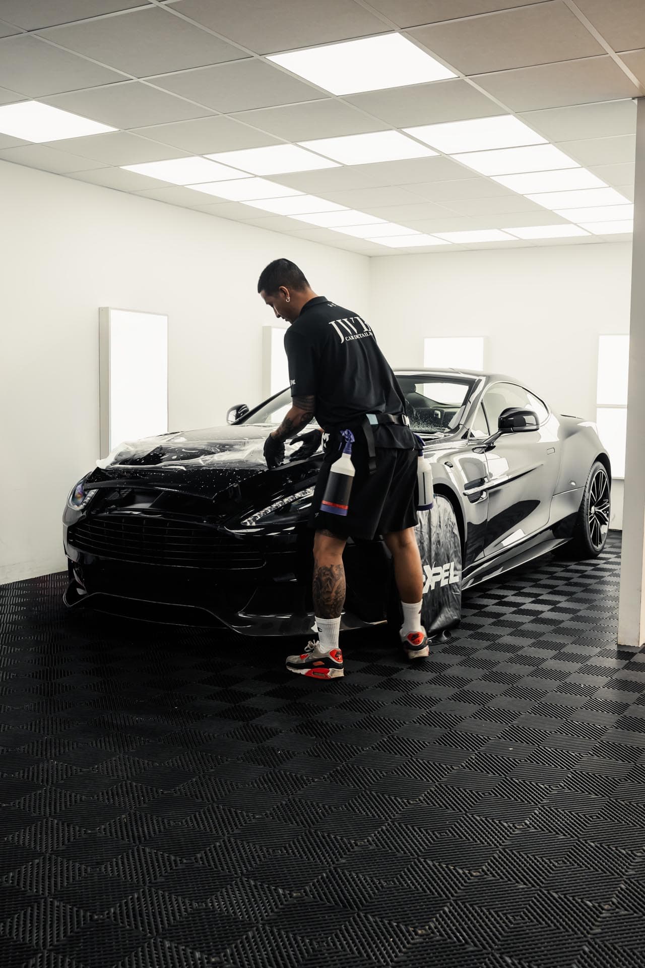 A JWB detailer assessing a vehicle
